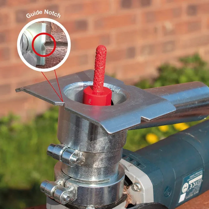 Angle grinder with a diamond mortar raking blade clearing a brick joint