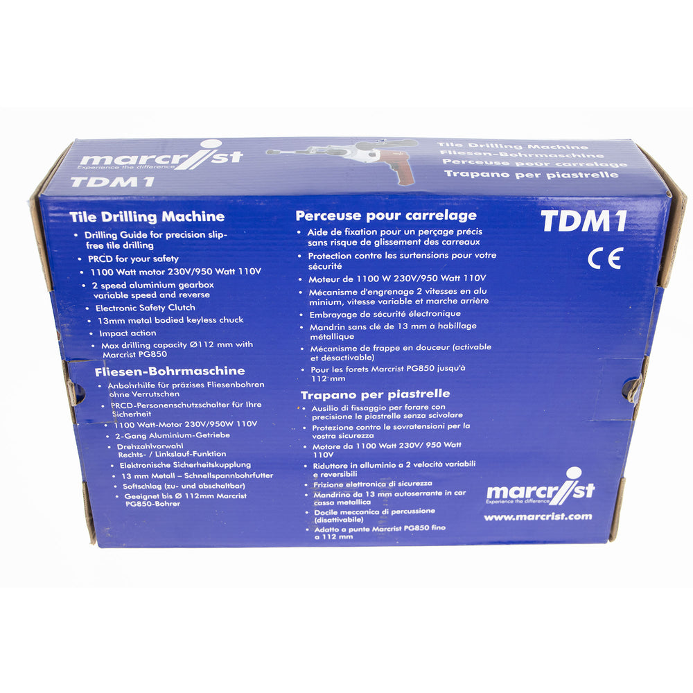 A blue cardboard box for a Marcfríst TDM Tile Drilling Machine, showing the product specifications and technical details in both English and French.