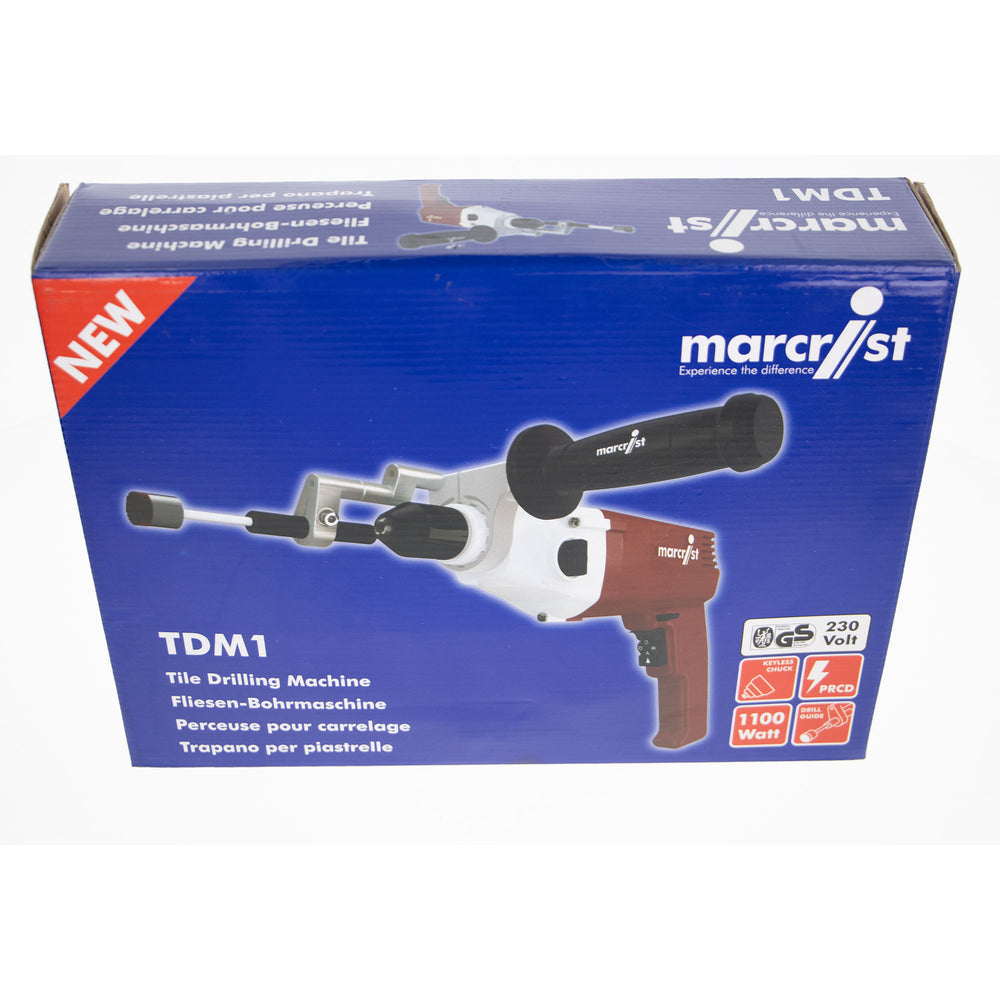 Blue retail box for a Marcist TDM1 tile drilling machine, showing the drill machine pictured on the front and product details including 230 Volts and 110W.