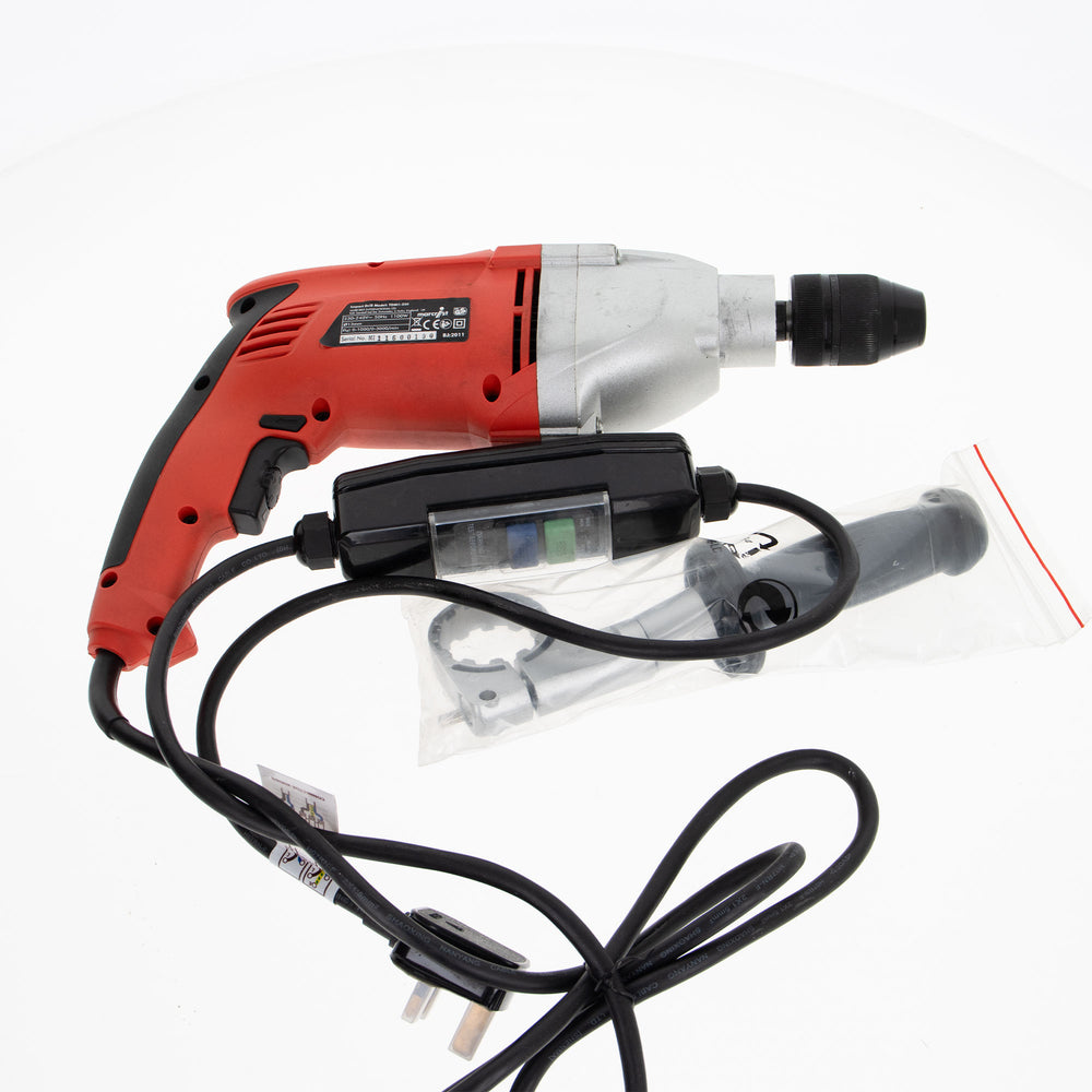 Red and silver cordless drill driver with a black power cord, black switch, and a clear plastic bag containing a drill chuck adapter, shown on a white background.